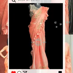 This peach-pink ruffled saree is a stylish and modern option for any party. It's pre-draped and easy to wear, giving you a glamorous look without the effort.