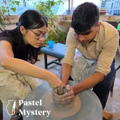 Here I am guiding a couple as they center the clay on the wheel together. It’s a moment of focus and teamwork, and the first step to creating something beautiful.