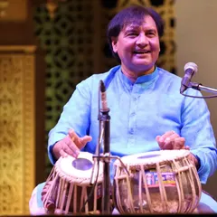 A smile during a performance is a sign that the audience and the artist are connected as one. This was captured during a tabla duet, a moment of pure happiness in the flow of rhythm.