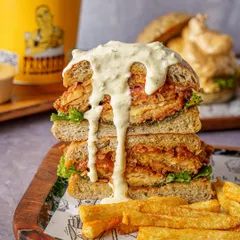 This is how you shoot a burger. It’s not just about stacking ingredients; it’s about capturing that messy, drippy, can’t wait to eat it feeling. This kind of food photography is perfect for delivery apps and social campaigns that need to make an impact.