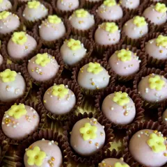 Handcrafted, adorable mini desserts I created for a Louis Vuitton event. These are tiny cake bites topped with delicate buttercream flowers and sprinkles.