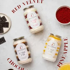For a small joy or a sweet craving, our cake jars are the perfect solution. This shot shows our three popular flavors: classic Chocolate, rich Red Velvet, and tropical Pineapple, all freshly made and full of flavor.