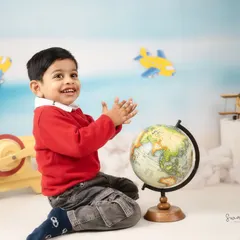 Planning his next big trip around the globe. The pilot and traveler theme is wonderful for capturing a child's sense of wonder and excitement.