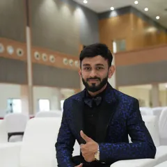 Relaxing before a show in my formalwear. Being comfortable and confident in what I wear allows me to focus completely on my hosting duties and the audience.