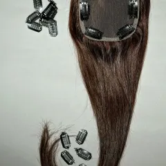 This hair topper is shown with extra clips, demonstrating how I can customize the piece for added security. It's a perfect solution for instant volume and confidence.