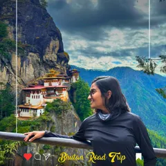 A woman looks at the iconic Tiger's Nest Monastery in Bhutan. This is a bucket-list moment, and my trips are designed to help you experience this spiritual and architectural wonder.