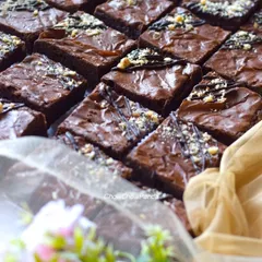 A batch of my classic fudgy brownies, ready to be packed. These are rich and sturdy, which is why they are a popular choice for sending as gifts, even to other cities.