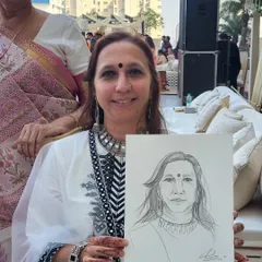 It's always a joy to draw guests who are so full of life. This quick charcoal sketch captures her warm smile. These portraits become great conversation starters during the event.