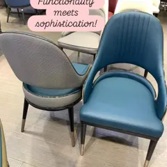 Functionality meets sophistication in these modern dining chairs. The design features a mix of textures, with a smooth blue leatherette front and a textured grey fabric back, all tied together with elegant metal-tipped legs.