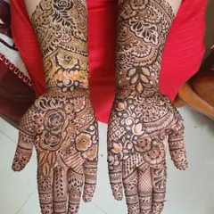 For those who love a full, rich design, I enjoy creating hyper-detailed floral patterns. This piece was a wonderful challenge, layering different flowers and textures to cover the hands and arms completely.