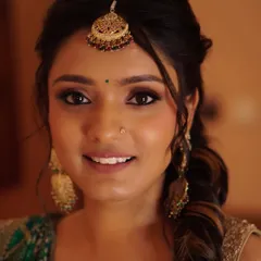 Nony's beautiful smile completes her Mehendi look. The makeup is warm and earthy, designed to enhance her natural features and complement the traditional feel of the ceremony.