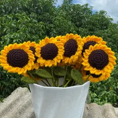 A classic sunflower bouquet arranged in a white vase, perfect for home decor.