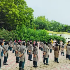 School girls stand in formation, ready to learn the fundamentals of situational awareness and self-defense at a government school in New Delhi.