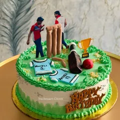 A perfect cake for a cricket lover's birthday. This design features a pitch, wickets, bat, ball, and player figures, capturing the excitement of the game.