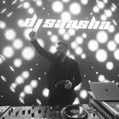 A moment of pure joy behind the decks. This black and white shot captures me in my element, with my logo lighting up the background. It's more than just playing music; it's about creating an unforgettable night.