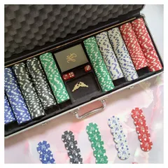 This personalized poker set features custom monogrammed chips in red, green, black, and blue, along with branded card packs. It's a perfect example of a high-end, custom gift for clients or employees.