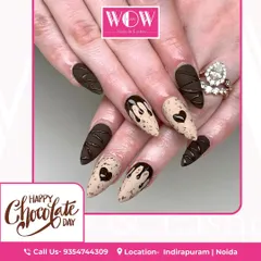 A sweet and decadent design perfect for celebrating. This look features a matte chocolate brown base with 3D drips and a cookie-speckled accent nail.