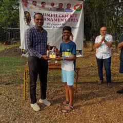 We celebrate every achievement. A young player receives the 'Best Batsman' trophy during the award ceremony of our internal tournament, recognizing individual performance and encouraging healthy competition.