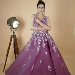 A full-length shot of the magenta gown, showing its impressive volume and elegant silhouette.