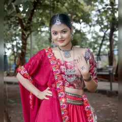 A confident pose showing the model's personality. This shot highlights the traditional tattoo on her hand and the beautiful craftsmanship of her ethnic attire.