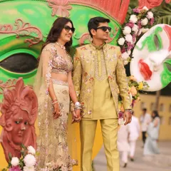Here is one of my clients looking sharp and confident at his Mehendi ceremony. He wears a custom-designed lime-green bandhgala jacket with a matching kurta, both adorned with delicate floral embroidery. This image captures how my bespoke creations come to life, blending perfectly with the joy and color of the celebration.