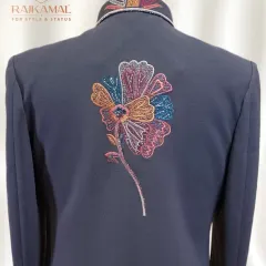 A view of the back of the dark navy blue Indo-Western jacket, showing how the striking floral embroidery creates a central design motif. The detailed collar adds another point of interest, making the garment impressive from every angle.