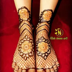 A floral-themed bridal leg design with large, bold rose motifs on the feet and ankles, complemented by a simple net pattern.