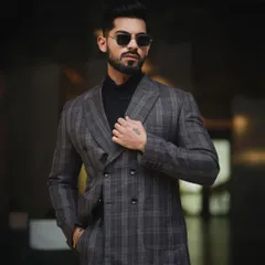 A classic, powerful portrait for a men's fashion portfolio. The focus here is on sharp tailoring and a confident stance, using controlled lighting to create a look that is both timeless and modern.