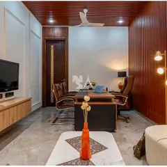 A view from the seating area, showing the executive desk set against a rich wood-paneled wall. The design balances professional gravitas with the comfort of a residential space.