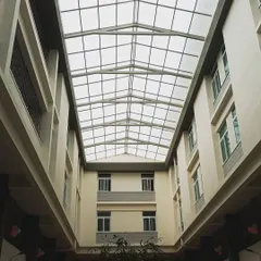 Natural light is a key material in my designs. This expansive skylight over the courtyard at the St. John's hostel block transforms the space, filtering light deep into the building and creating a bright, uplifting environment for residents.