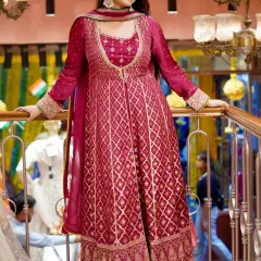 Own the outfit, own the spotlight. This beautiful magenta Anarkali-style suit with palazzo pants features rich brocade work, perfect for a wedding function.
