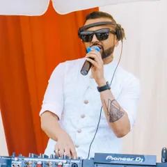 As a wedding DJ and MC, I'm right there on the mic, interacting with the guests and keeping the energy high during this beautiful outdoor Mehendi function.