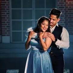 A tender embrace during their pre-wedding session. The cool blue tones and soft lighting add to the romantic mood of this beautiful couple portrait.