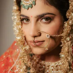 The power of a direct gaze. This intense and beautiful close-up of bride Ananya captures her confidence and the intricate details of her nath and maang tikka.