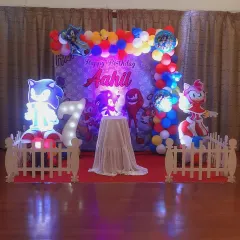 Here is a Sonic the Hedgehog theme I created for a 7th birthday. The stage features multiple light-up character standees, a themed backdrop, and a balloon arch in Sonic's signature colors, all set up for an action-packed celebration.