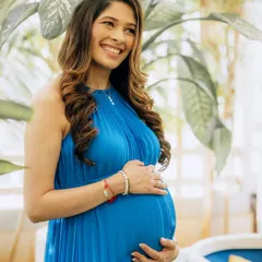 Celebrating motherhood in all its forms. This radiant mom-to-be is glowing in a timeless blue dress for her baby shower. The makeup is soft, elegant, and designed to enhance her natural pregnancy glow.