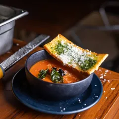 A warm bowl of my Roasted Tomato Soup is like a hug from the inside. It's served with a crispy Parmesan Crostini topped with pesto, perfect for dipping. This is simple, classic comfort at its best.