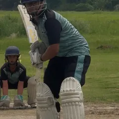 A batsman ready at the crease, with the wicket keeper and slips in position. This is the intensity of a real match situation.