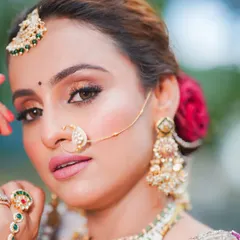 A close-up of the final bridal look, showing the detailed eye makeup with a soft cut-crease, perfectly blended skin, and a matte pink lip. This HD makeup is designed to last through all the ceremonies and look amazing in photos.
