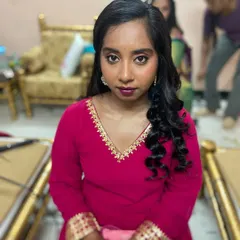 The final look. She is ready for her event, looking confident and beautiful with her party-ready hair and makeup.