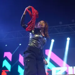 Waving a red bandana to hype up the crowd during a New Year's 2025 performance. The energy was electric.