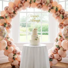 The cake cutting is a key moment, and I design beautiful displays to highlight it. This elegant, circular balloon arch in pastel pink and rose gold, accented with flowers, creates a romantic frame for the wedding cake.