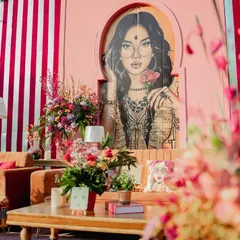 A closer look at the pop-art themed Mehendi lounge. The custom artwork adds a bold, modern twist, while the plush orange sofas and colourful cushions ensure guests are comfortable and stylish.