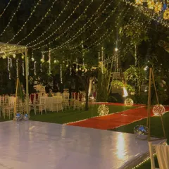 The dance floor is ready. We set up a pristine white dance floor under a canopy of string lights, creating the perfect space for a night of dancing and celebration.