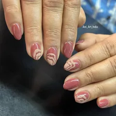 This abstract design was inspired by the look of sand art, with earthy tones and flowing lines.