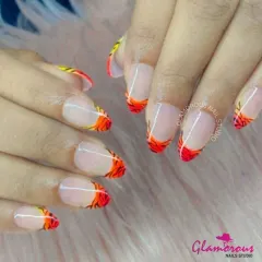 French tips, but make them fierce. We gave this classic look a fiery update with hand-painted orange and yellow flames licking the tips of the nails. This design is guaranteed to bring the heat.