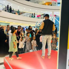 Engaging with the audience is the best part of any live show. Here I am interacting with a young participant during our Eid special performance at Inorbit Mall.