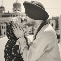 A quiet moment of blessing and love amidst the sacred atmosphere of the Gurudwara. This tender forehead kiss captures the pure, unspoken connection between Gurjot and Mrityunjay, a black and white photo that feels eternal.