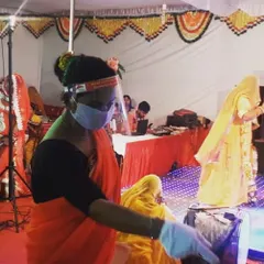 Our staff member, dressed in a traditional saree and following all safety protocols, serving at a Rajputana wedding. We respect and adapt to the cultural traditions of every event.