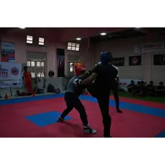 An action shot from the 4th Mumbai City Kickboxing Championship. Our fighters are trained to maintain composure and strategy under pressure, seen here as they exchange blows in a competitive bout.